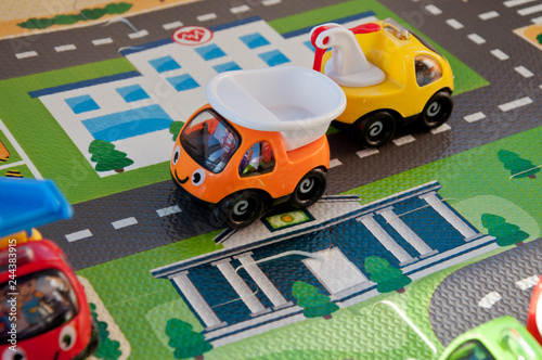 Background from children's toys. Miniature city and small cars.