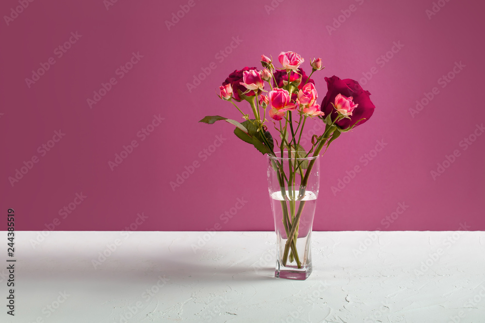 Vase with roses on the table Vase with roses on the table
