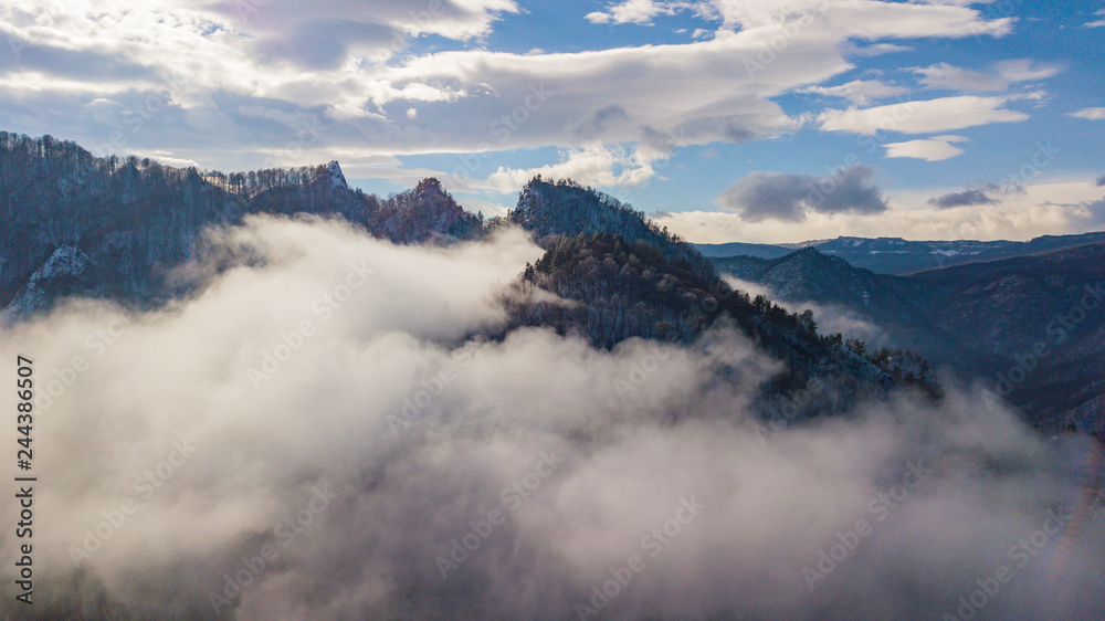 Aerial mountain fog covered the famous rock Lagonaki in morning light.