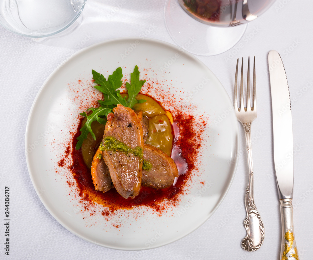 Duck fillet with sauce, pepper and greens