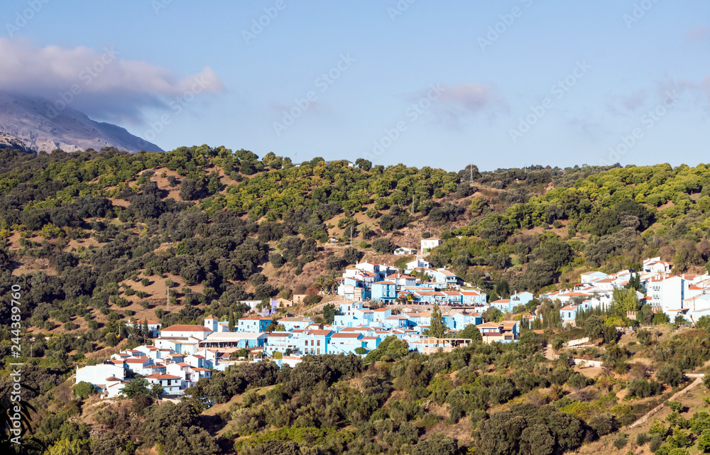 Village of white houses in the Sierra de Malaga, in Spain, on a sunny day.