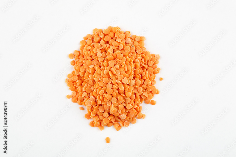 Pile of red lentils on a white background Pile of red lentils on a white background
