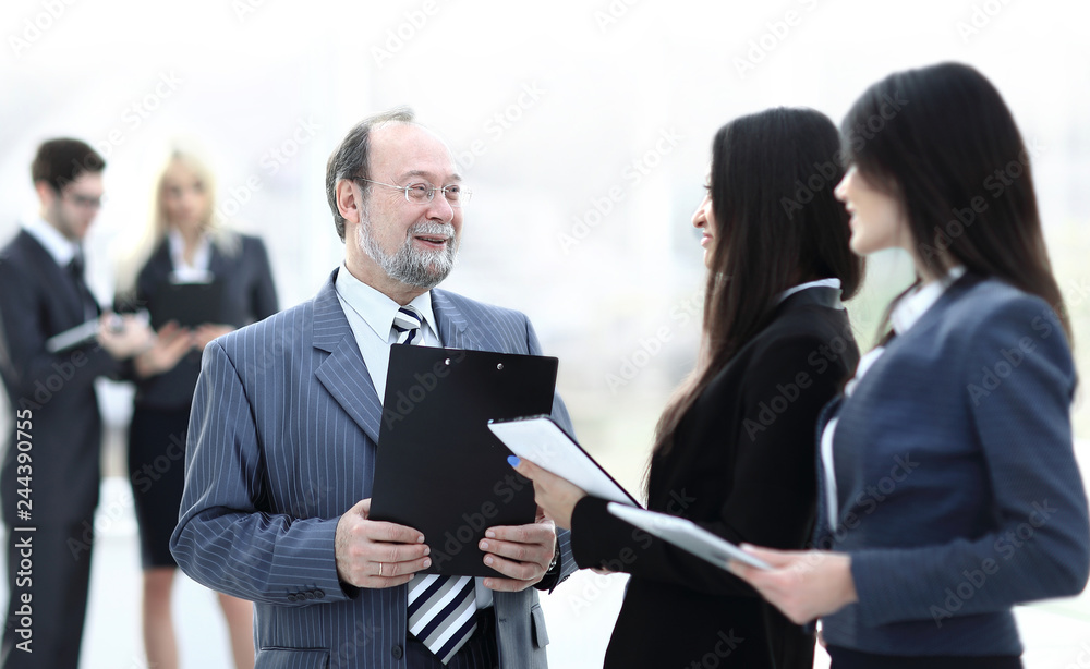 close up.group of business people standing in lobby of office. close up.group of business people standing in lobby of office.
