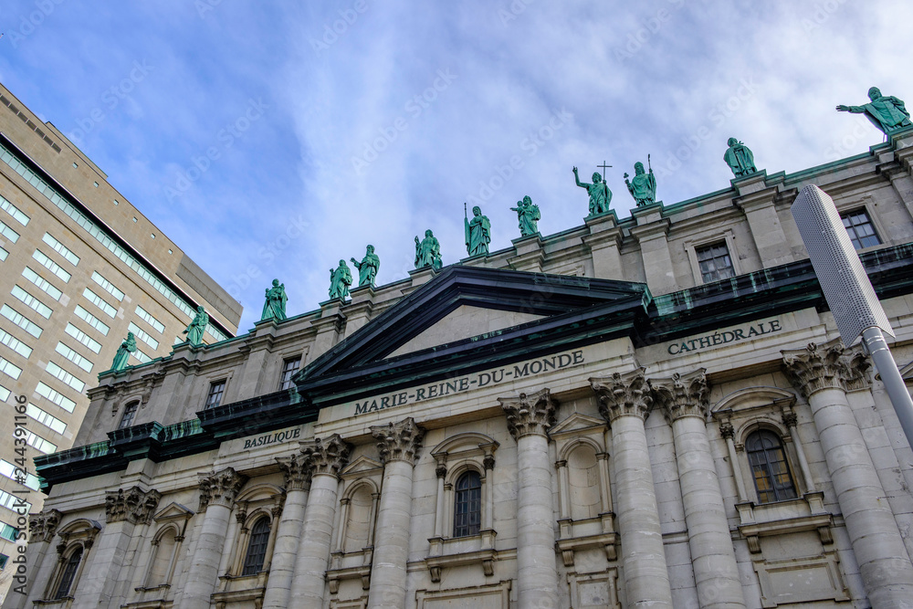 Fototapeta premium Scenic beautiful view of Cathedral of Marie-Reine-du-Monde (Mary, Queen of the World Cathedral) in Montreal. Depressive winter look of old catholic cathedral in the largest megapolis city of Quebec