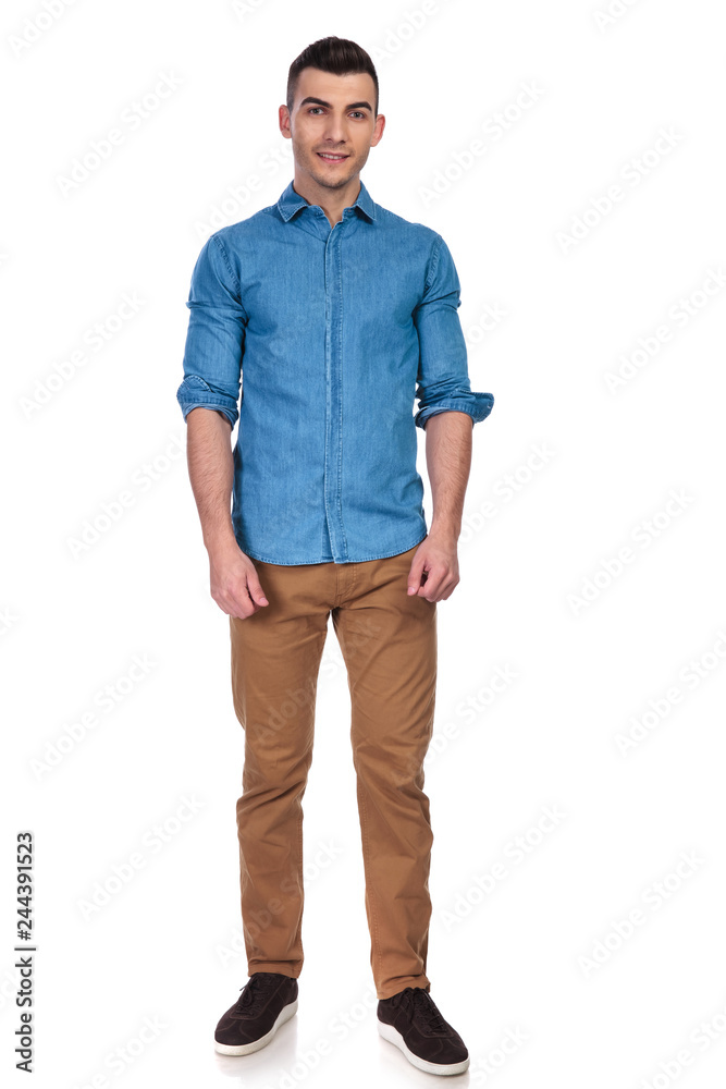 young and handsome man wearing blue shirt standing young and handsome man wearing blue shirt standing