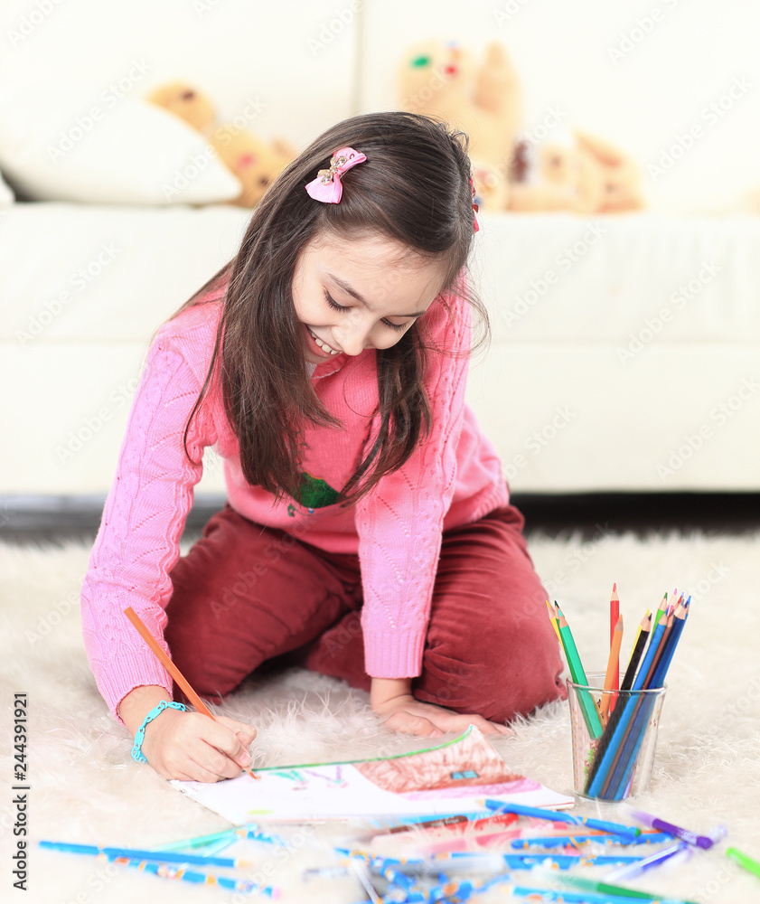smiling girl paints with pencils. photo with copy space smiling girl paints with pencils. photo with copy space