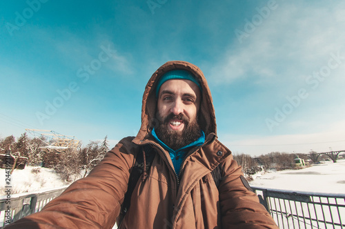 bearded man talking on the camera, quick selfie