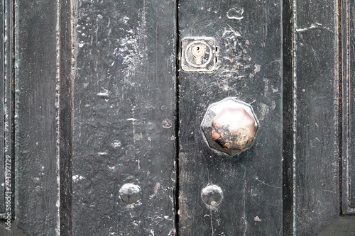 wooden door with lock and knocker © NUI BLANCO