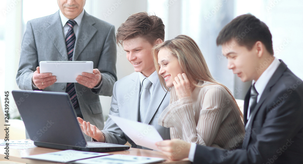close up.businessman and business team analyzing financial data. photo with copy space close up.businessman and business team analyzing financial data. photo with copy space
