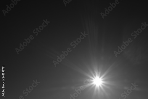 Sun light flare sky in black and white