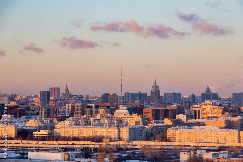 Panorama of evening Moscow. Winter landscape. Ostankino TV tower on the horizon.
