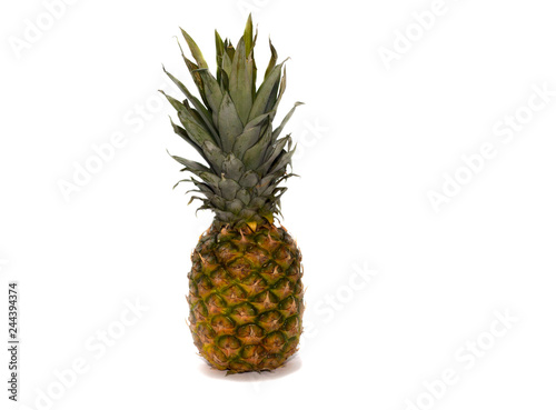 Single whole pineapple isolated on white background