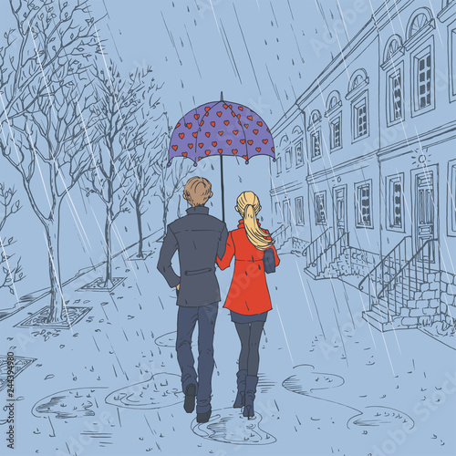 Couple walking down the street in the rain