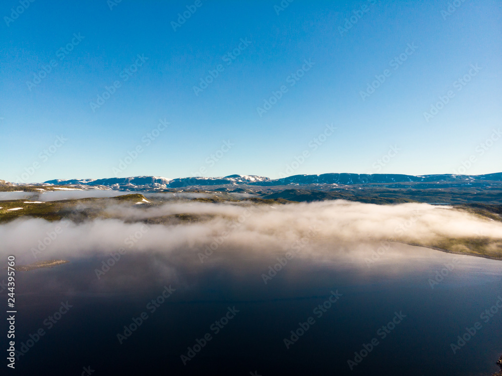 Clouds over lake water, Hardangervidda landscape, Norway