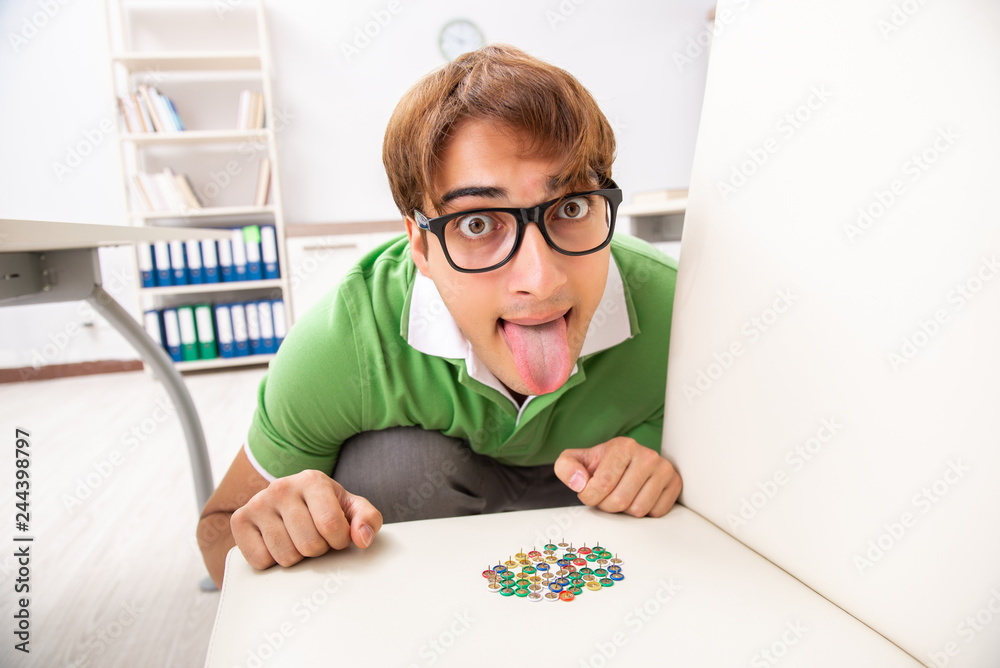 Office prank with sharp thumbtacks on chair Office prank with sharp thumbtacks on chair