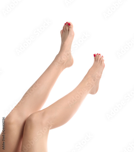 Female legs with beautiful pedicure on white background