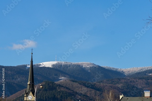 City  church and mountains with snow on the peaks. Slovakia