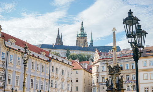 View of the castle in Prague from the Lesser Town with a plague column in the foreground