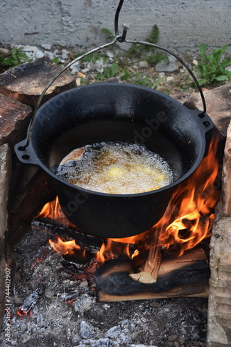 romanian cauldron (ceaun) with oil on the fire