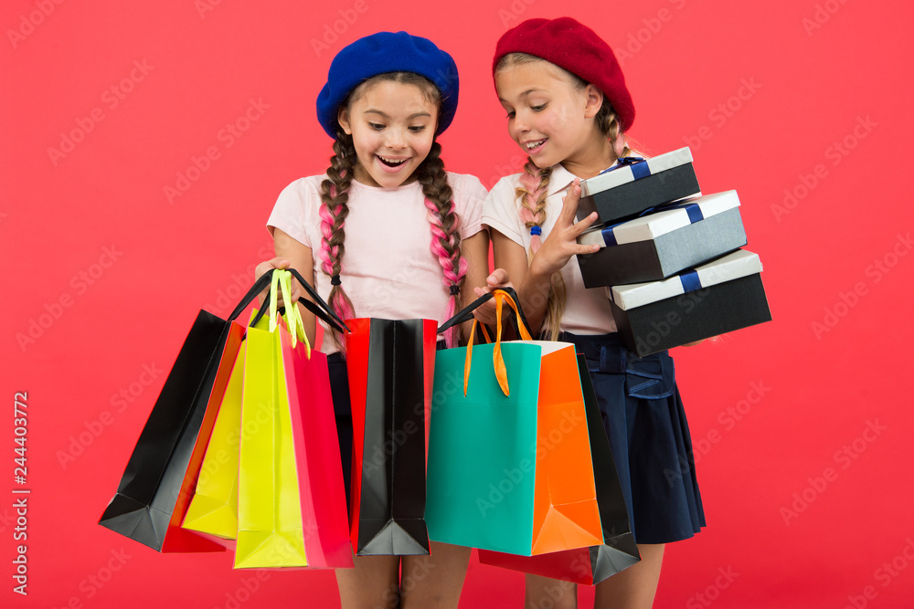 friendship and sisterhood. International childrens day. Birthday and christmas presents. small girl children with shopping bags. big sale in shopping mall. Happy shopping online. After shopping