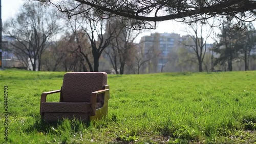 Soviet old armchair on green grass outdoor. photo