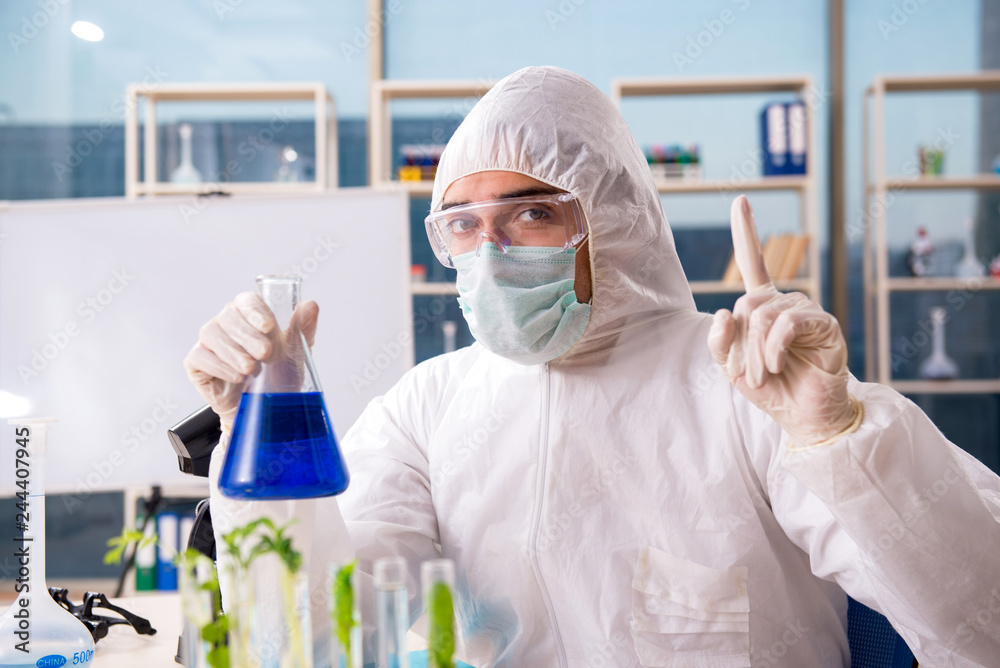 Male biotechnology scientist chemist working in the lab Male biotechnology scientist chemist working in the lab