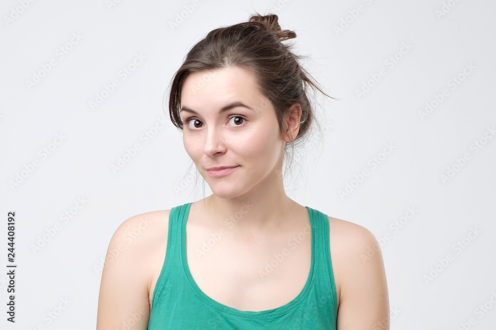 Young beautiful cute cheerful girl smiling looking at camera Young beautiful cute cheerful girl smiling looking at camera