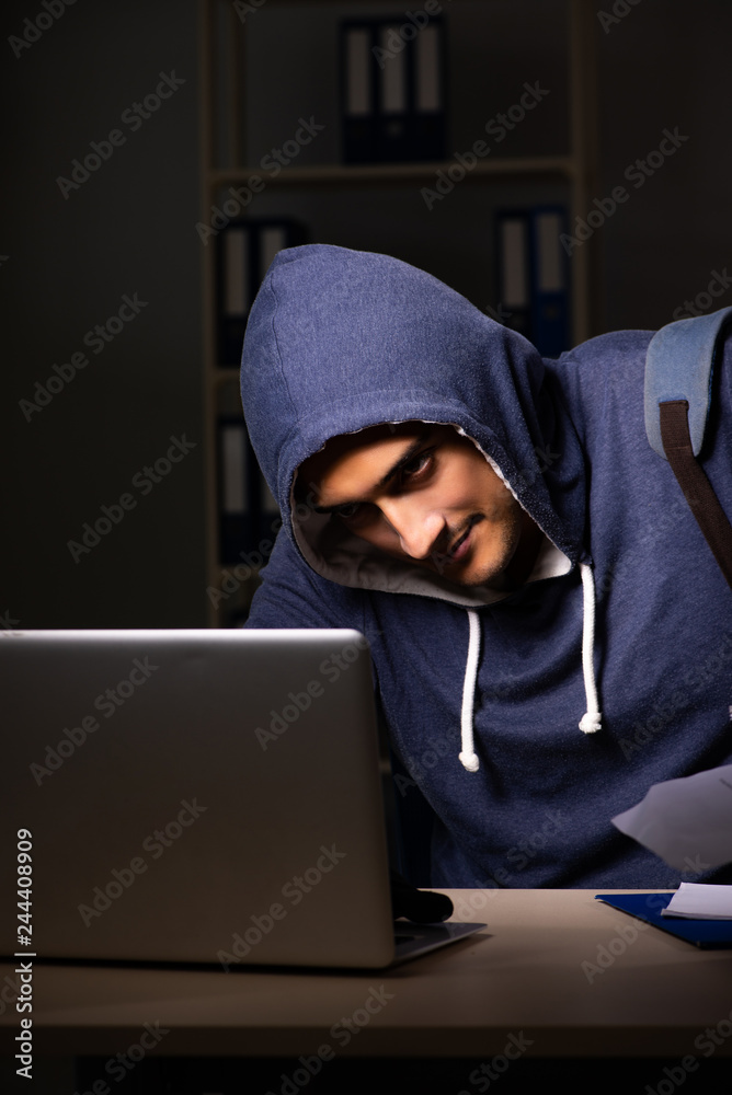 Thief trying to steal personal data in identity theft concept Thief trying to steal personal data in identity theft concept