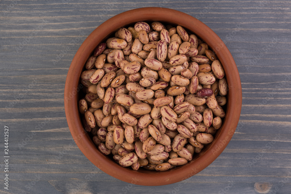 Fototapeta premium A plate of beans on wooden table background