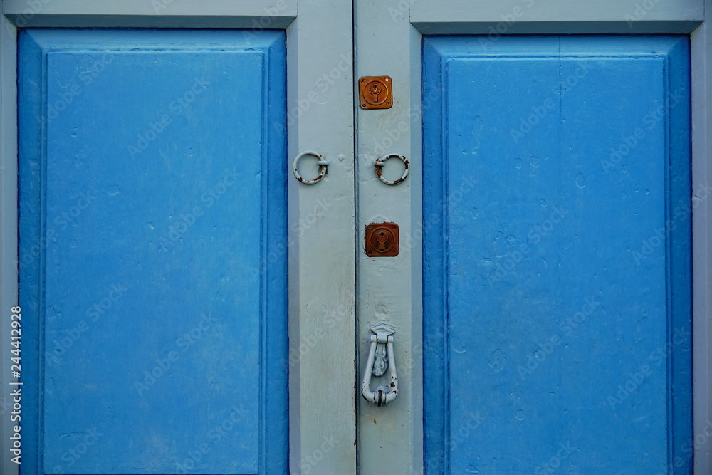 wooden door with lock and knocker