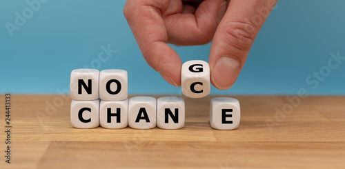 No change, no chance. Hand turns a dice and changes the expression "no change" to "no chance"