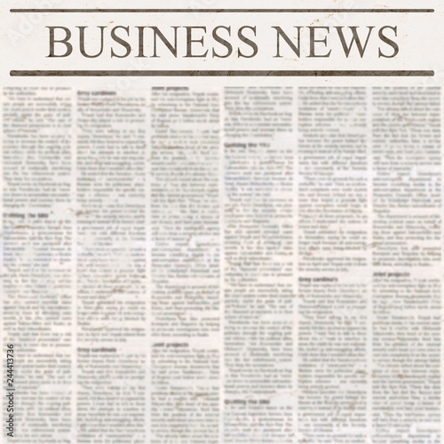 Newspaper with headline Business News and old unreadable text