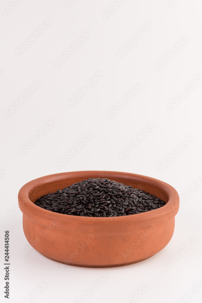 bowl of black wild rice isolated on white background bowl of black wild rice isolated on white background