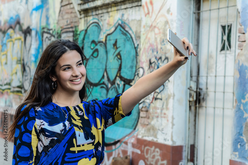 Latin woman making selfie.