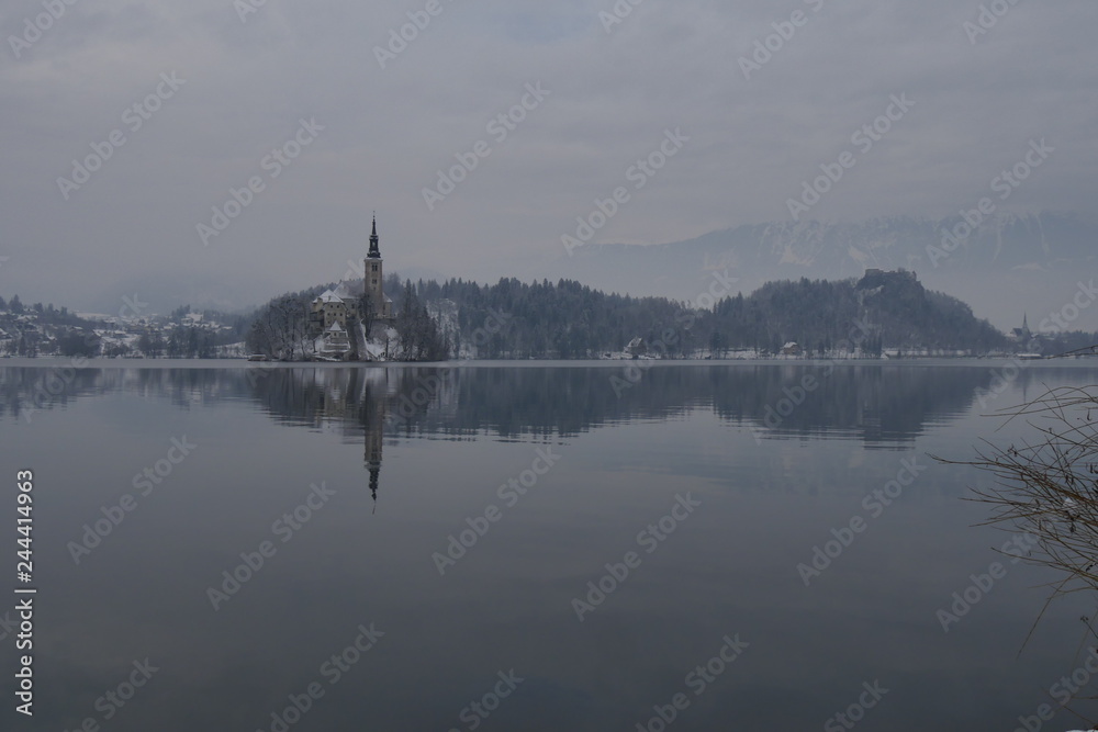 Romantic Panorama of Bled Church in the Island Winter with White Snow and Nobody