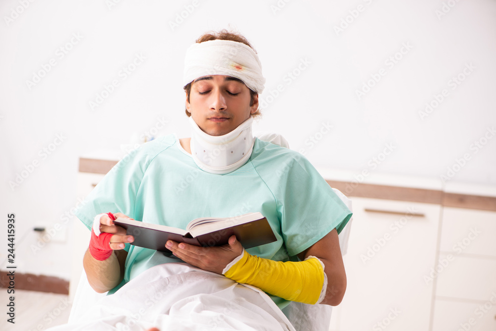 Young injured man staying in the hospital Young injured man staying in the hospital