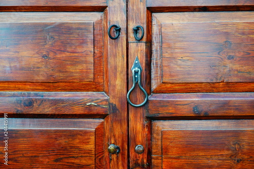 wooden door with lock and knocker