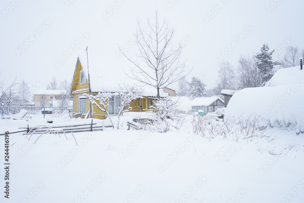 Winter village. House covered in snow