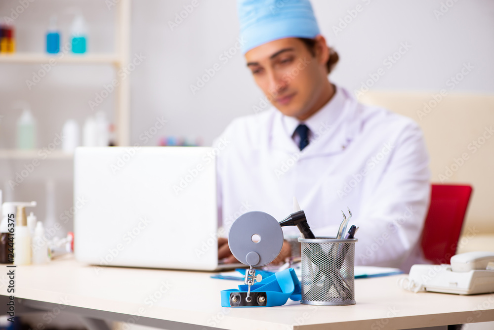 Young male doctor otolaryngologist working at the hospital Young male doctor otolaryngologist working at the hospital