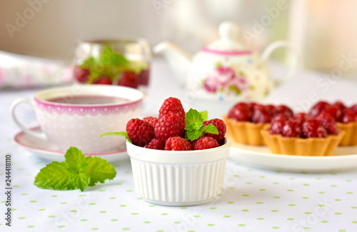 Homemade mini tarts with raspberries fruits