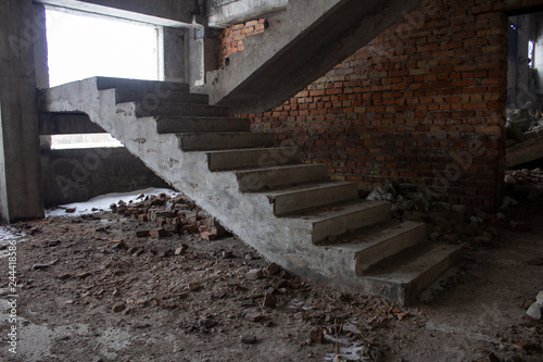 Fotografie Stair on ruins of the neglected unfinished building..