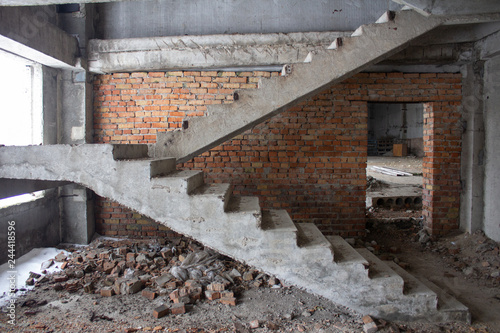 Tablou pe pânză Stair on ruins of the neglected unfinished building..