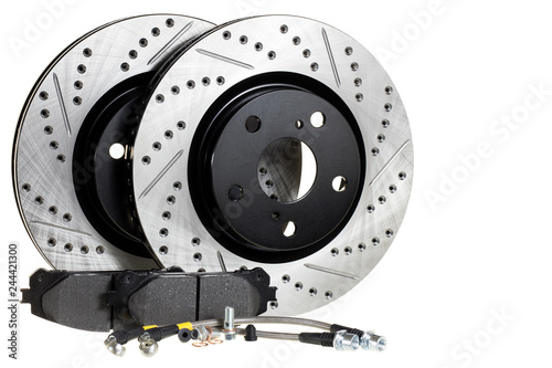 brake disc, pad and reinforced brake hose on a white background photo