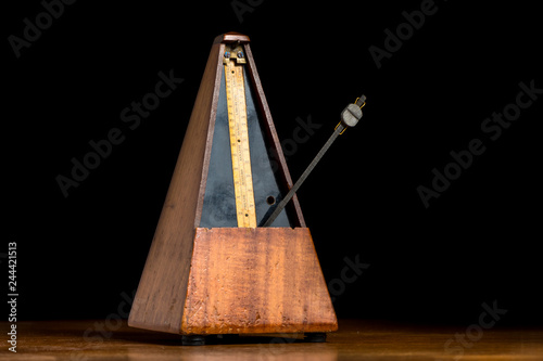 Detail of an old mechanic musical metronome