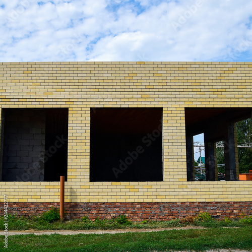House under construction from yellow bricks