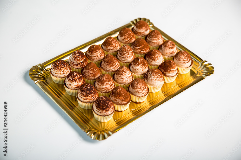 chocolate cupcakes in a tray on white background chocolate cupcakes in a tray on white background