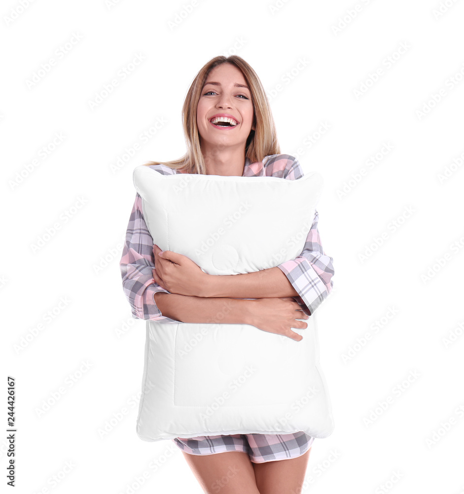 Young woman in pajamas embracing pillow on white background Young woman in pajamas embracing pillow on white background