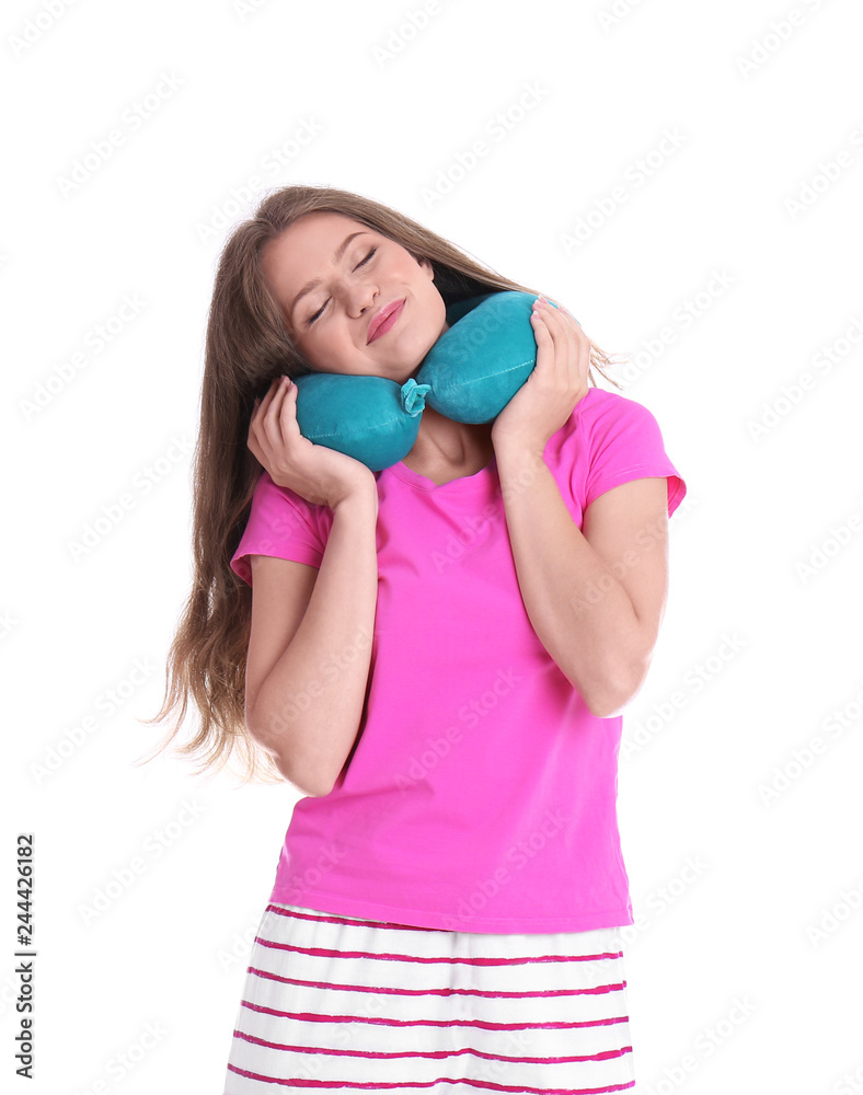 Happy young woman in pajamas with neck pillow on white background Happy young woman in pajamas with neck pillow on white background