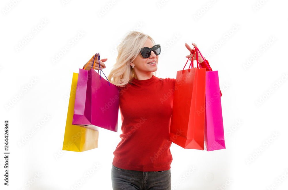 Attractive blonde with shopping bags studio shot Attractive blonde with shopping bags studio shot