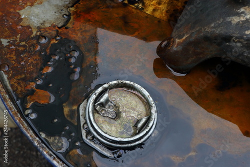 engine oil and oil cans in a car garage
